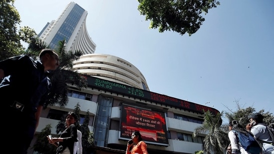 Stock market crash: People walk past the Bombay Stock Exchange (BSE) building in Mumbai, India, March 9, 2020(Francis Mascarenhas/Reuters)